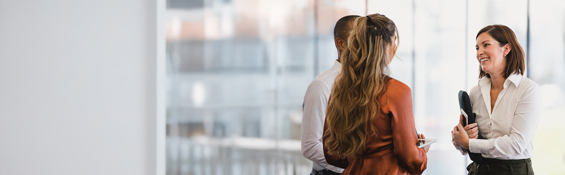 Photo of a group of people smiling at each other
